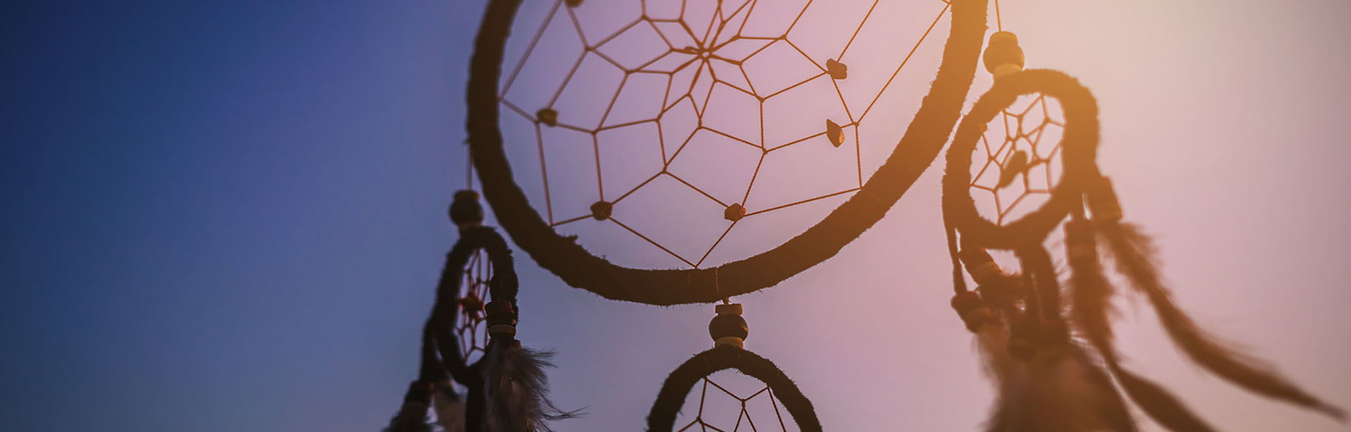 Dream catcher in the wind with beautiful  sunset, Ethnic amulet