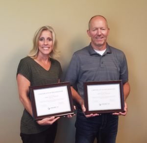 Amy Plagenz and Cory Te Kulve receiving their C.A.R.E. Award from Lakeland Care