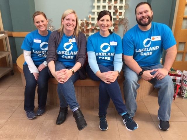 Group of Lakeland Care staff volunteering at nursing home in Oshkosh, WI.
